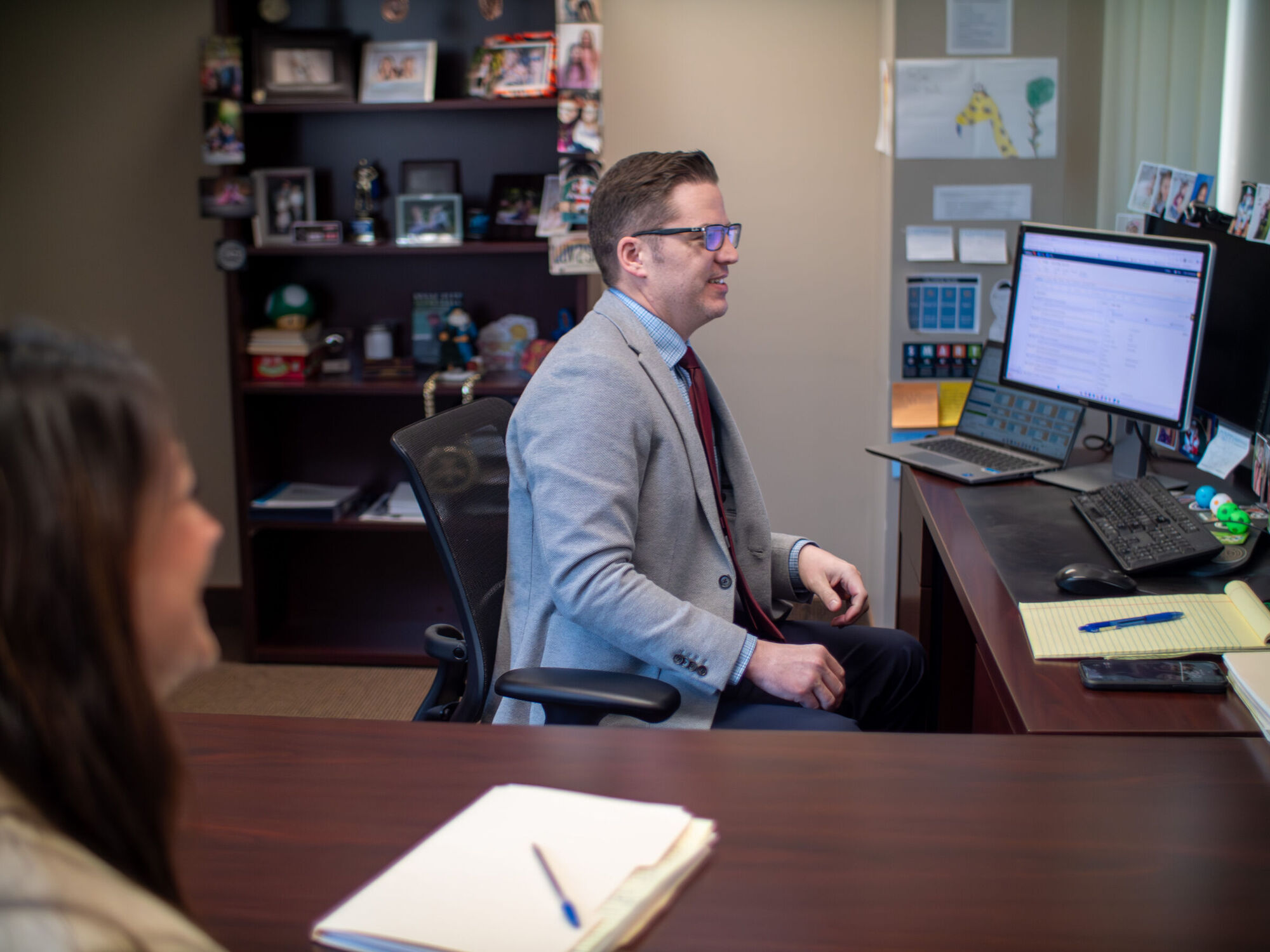 An executive reading a diagnostic report at their desk