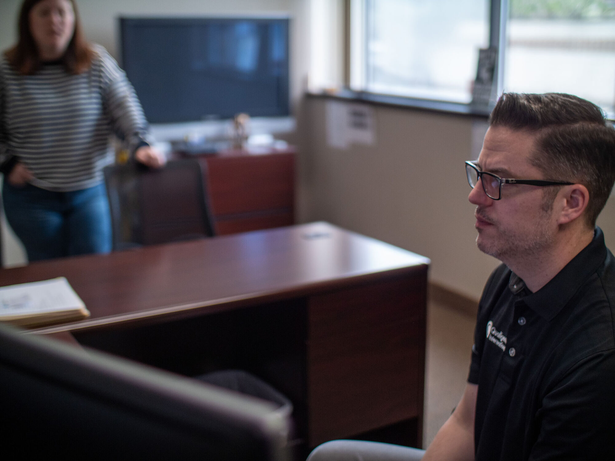 The Qualigence recruiting floor working live searches